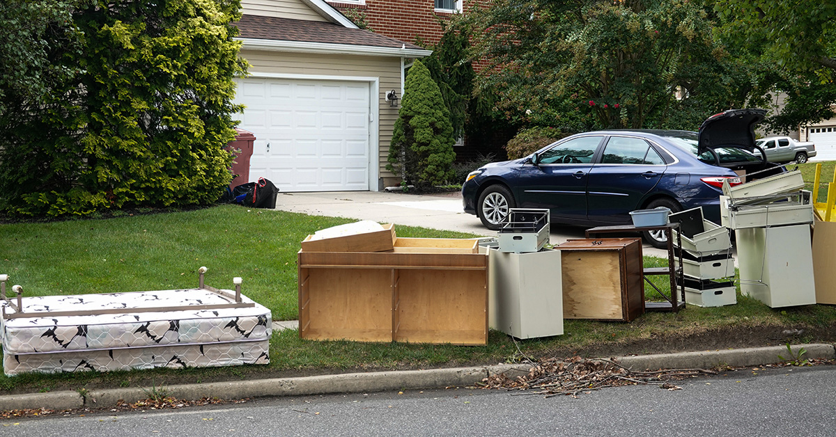 junk on the curb of a residential neighborhood